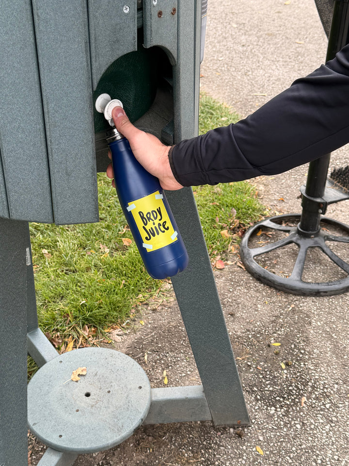 Brdy Juice water bottle on a course bench